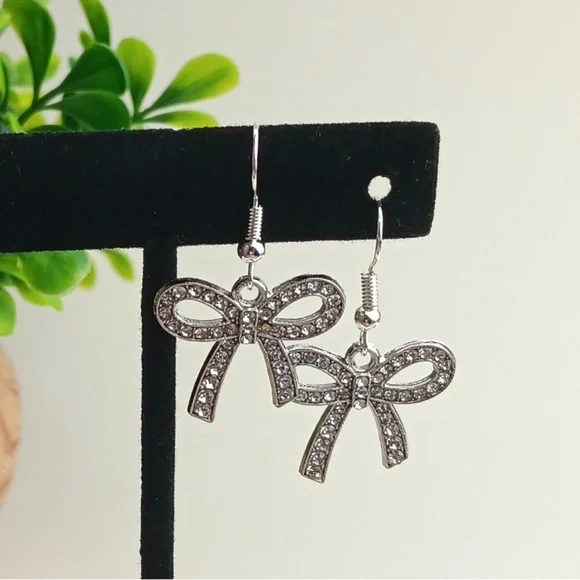 Elegant Silver Tone Bow Earrings - Picture 2 of 3